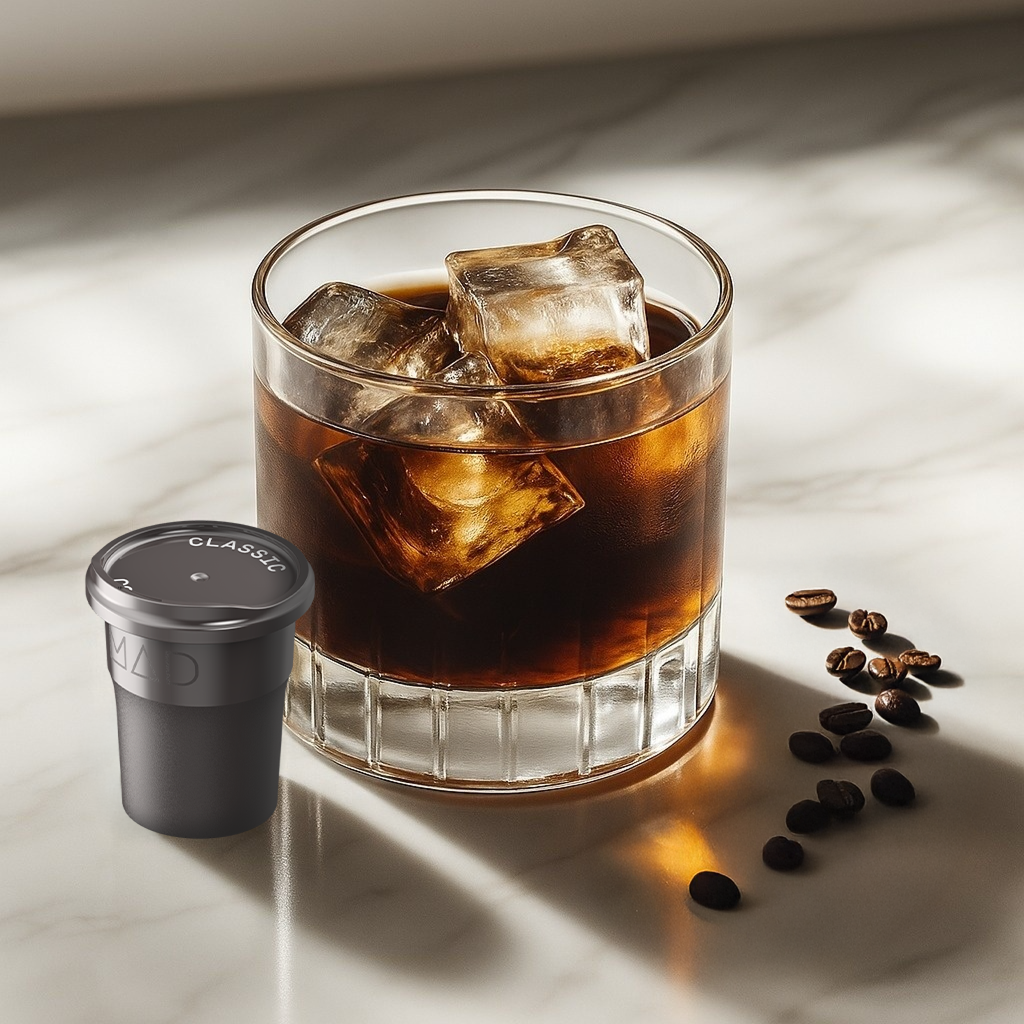 Mad Coffee Classic coffee product beside a glass of iced coffee